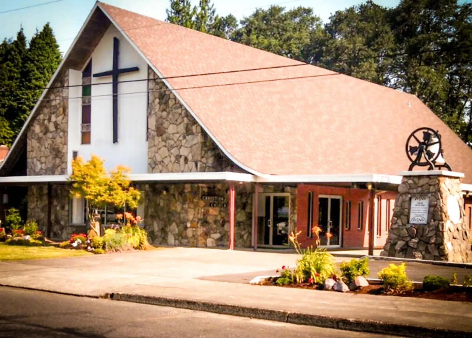 The Woodland Christian Church building on Buckeye Street, with its stone front and tall cross