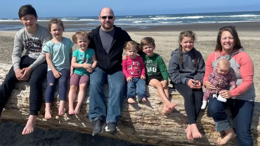 Elder Jake Motzkus with his wife Kelli and their seven children